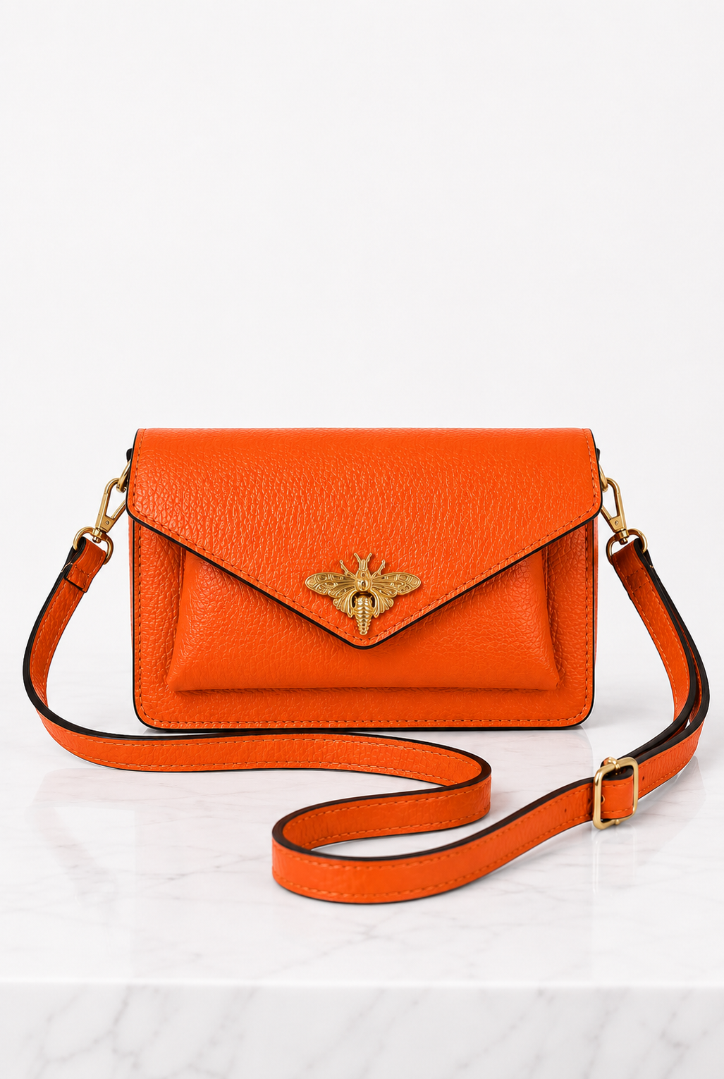 Borsa arancione in vera pelle con tracolla staccabile e regolazione a scorrimento