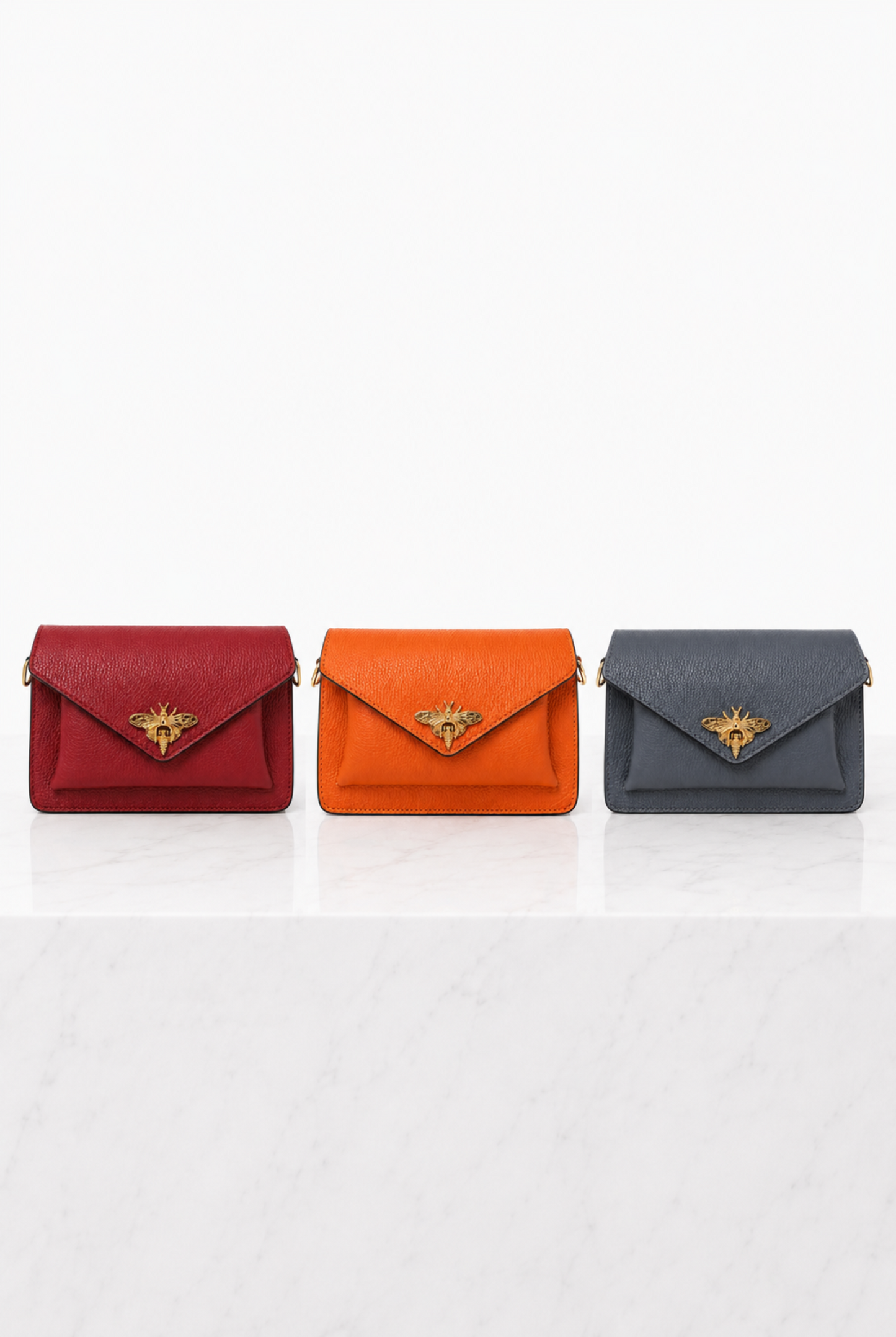 Borse donna in vera pelle con ape dorata nei colori rosso, arancione e grigio azzurro