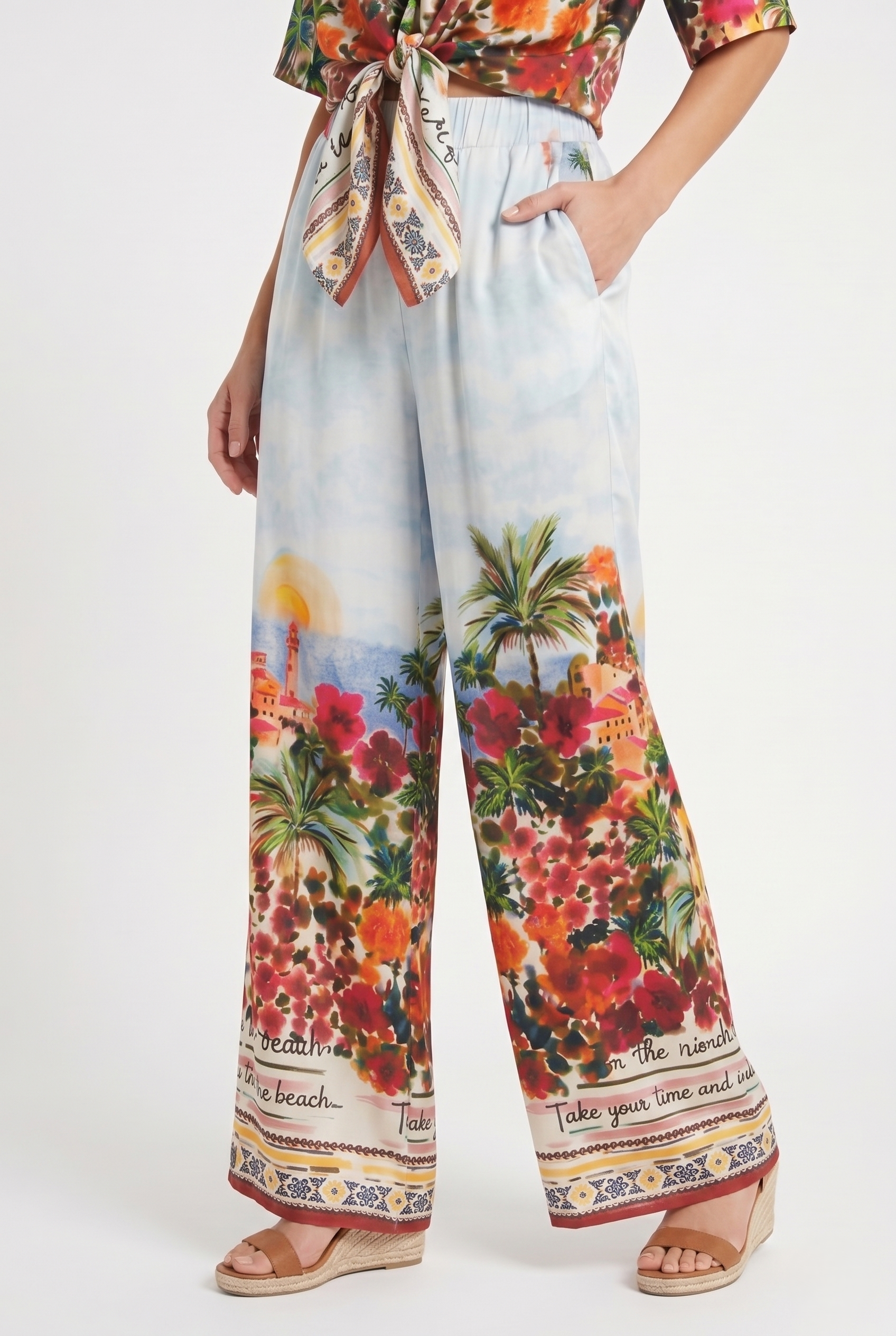 pantalone donna con tasche laterali fluido estivo con fantasia floreale mediterranea